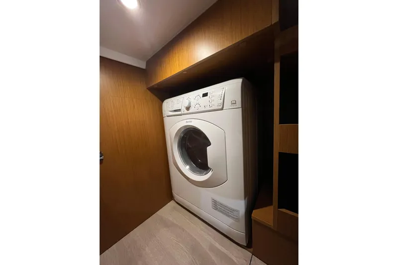  Yacht Photos Pics Laundry area with washing machine in 2026 Beneteau 41 Swift Trawler Sedan.