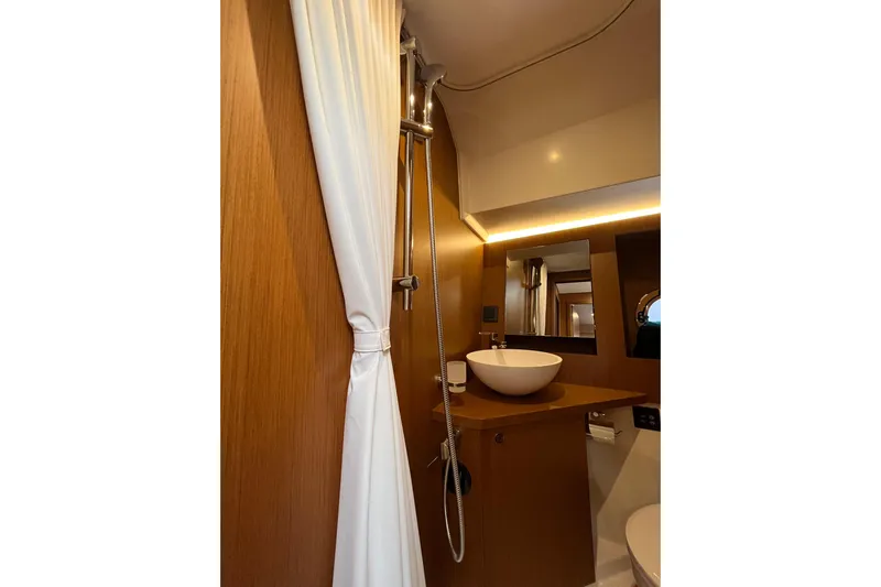 Yacht Photos Pics Bathroom interior of 2026 Beneteau 41 Swift Trawler Sedan with modern sink and shower.