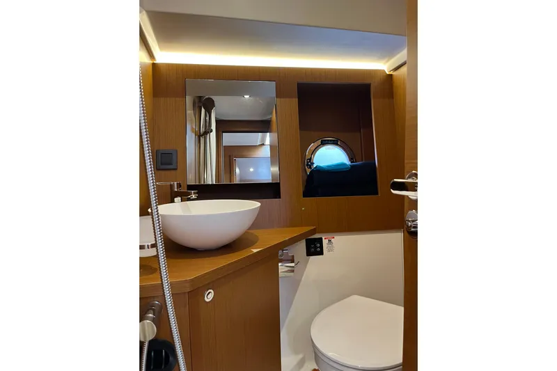  Yacht Photos Pics Bathroom interior of 2026 Beneteau 41 Swift Trawler Sedan with modern fixtures.