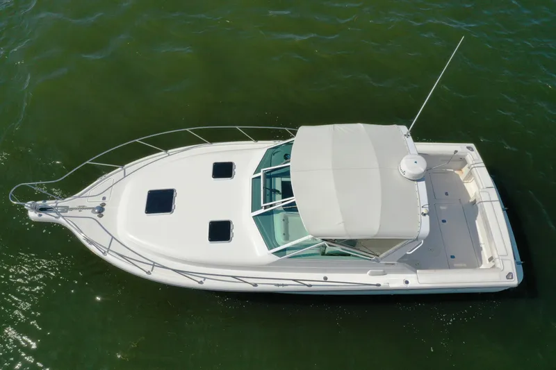  Yacht Photos Pics Aerial view of 2001 Tiara 31 Open boat on green water.