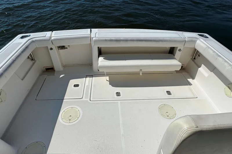  Yacht Photos Pics 2001 Tiara 31 Open boat deck with white seating and storage compartments.