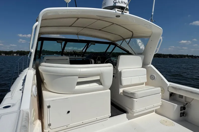  Yacht Photos Pics 2001 Tiara 31 Open boat interior with seating, on a sunny day at sea.