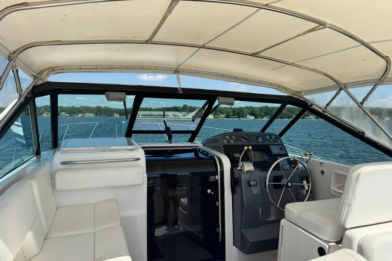  Yacht Photos Pics Interior view of 2001 Tiara 31 Open yacht cockpit on a sunny day.