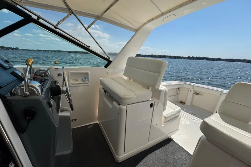  Yacht Photos Pics 2001 Tiara 31 Open boat interior with helm, seating, and ocean view.