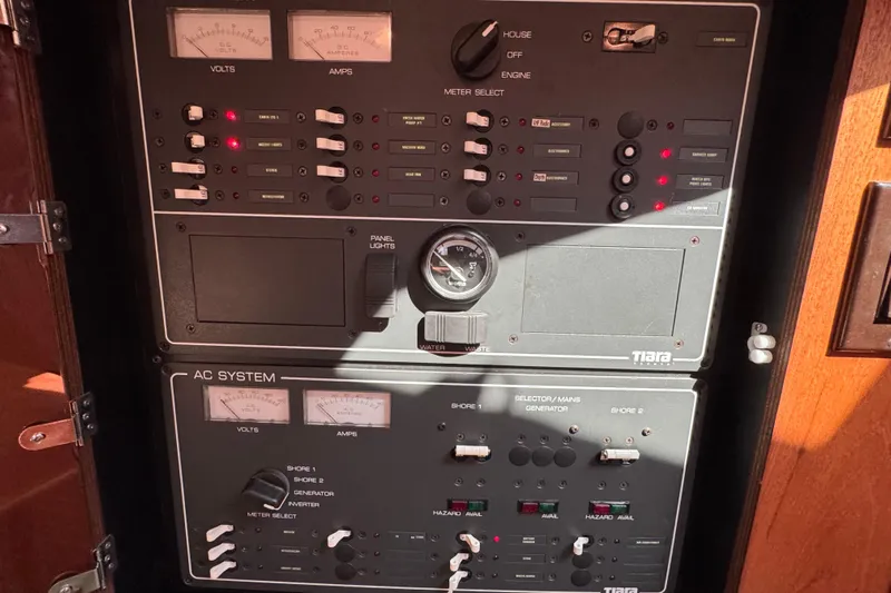  Yacht Photos Pics Electrical control panel on a 2001 Tiara 31 Open boat, featuring volt and amp meters.