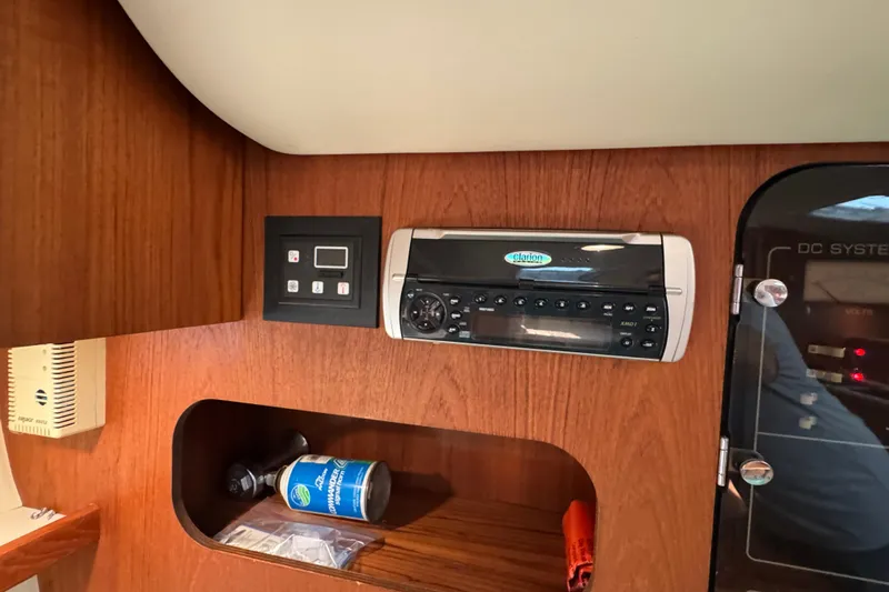  Yacht Photos Pics 2001 Tiara 31 Open cabin interior with Clarion stereo system and control panel.