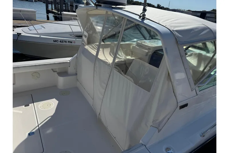  Yacht Photos Pics 2001 Tiara 31 Open boat with covered cockpit, docked at marina.