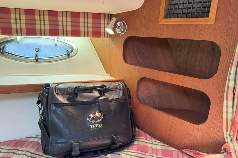  Yacht Photos Pics Interior of 2001 Tiara 3100 Open yacht with leather Tiara bag on bed.