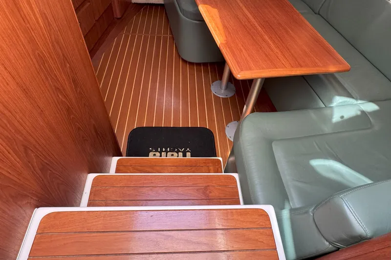  Yacht Photos Pics Interior of 2001 Tiara 3100 Open yacht with wooden flooring and seating area.