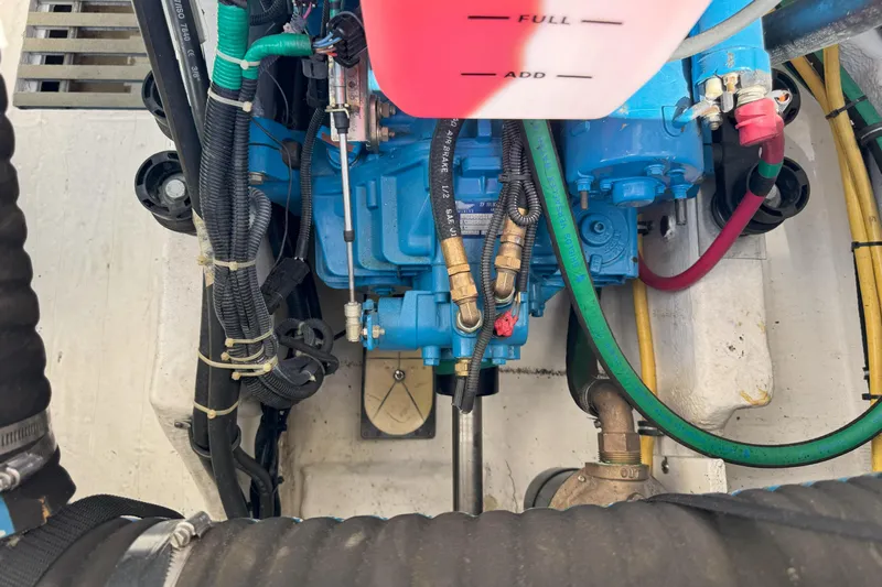  Yacht Photos Pics Engine compartment of a 2001 Tiara 3100 Open boat, showing hoses and components.