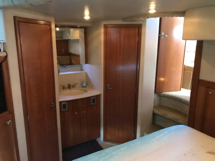 Good Times Yacht Photos Pics Interior of 2004 Meridian 459 Motoryacht with wood cabinetry and compact bathroom.
