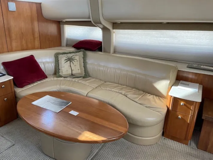 Good Times Yacht Photos Pics Luxurious 2004 Meridian 459 Motoryacht interior with leather seating and wooden table.