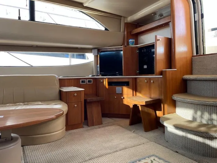 Good Times Yacht Photos Pics Luxurious interior of 2004 Meridian 459 Motoryacht with elegant wood finishes and comfortable seating.