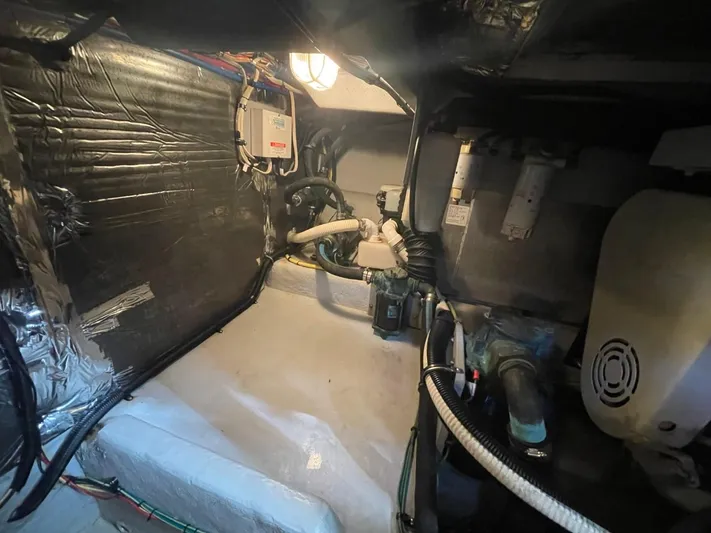 Good Times Yacht Photos Pics Engine room of 2004 Meridian 459 Motoryacht, showcasing mechanical components and wiring.