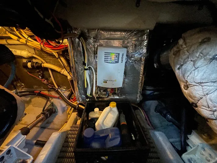 Good Times Yacht Photos Pics Engine room of 2004 Meridian 459 Motoryacht with electrical panel and maintenance supplies.