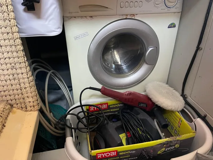 Good Times Yacht Photos Pics Laundry area on 2004 Meridian 459 Motoryacht with washing machine and cleaning tools.