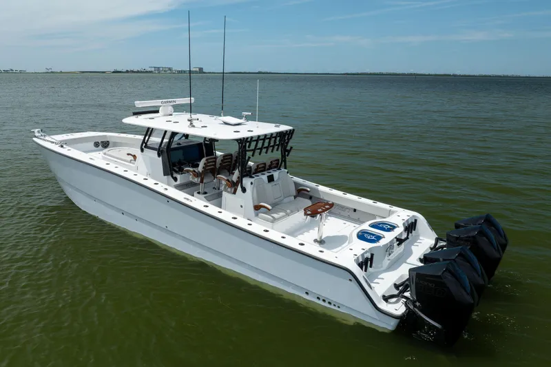  Yacht Photos Pics 2025 Freeman 42 LR boat on calm water, featuring multiple outboard engines.
