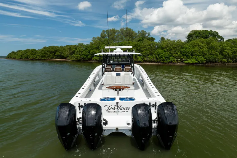  Yacht Photos Pics 2025 Freeman 42 LR boat with four engines on a scenic waterway.