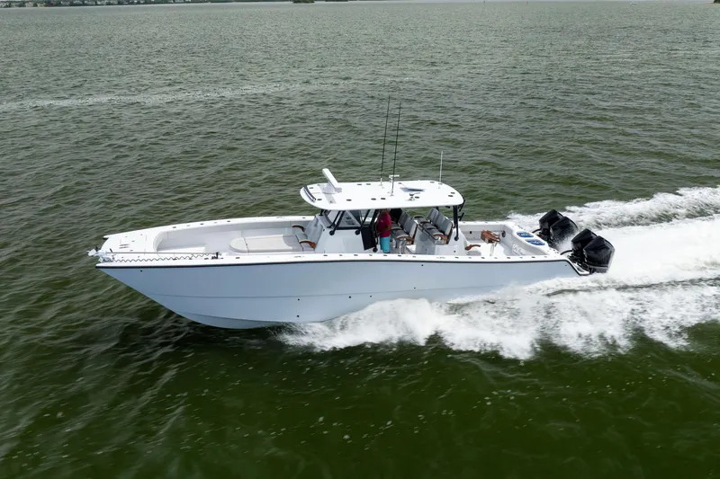  Yacht Photos Pics 2025 Freeman 42 LR boat cruising on open water, showcasing sleek design and powerful engines.