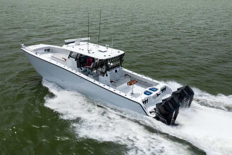  Yacht Photos Pics 2025 Freeman 42 LR boat cruising on open water, showcasing powerful engines.