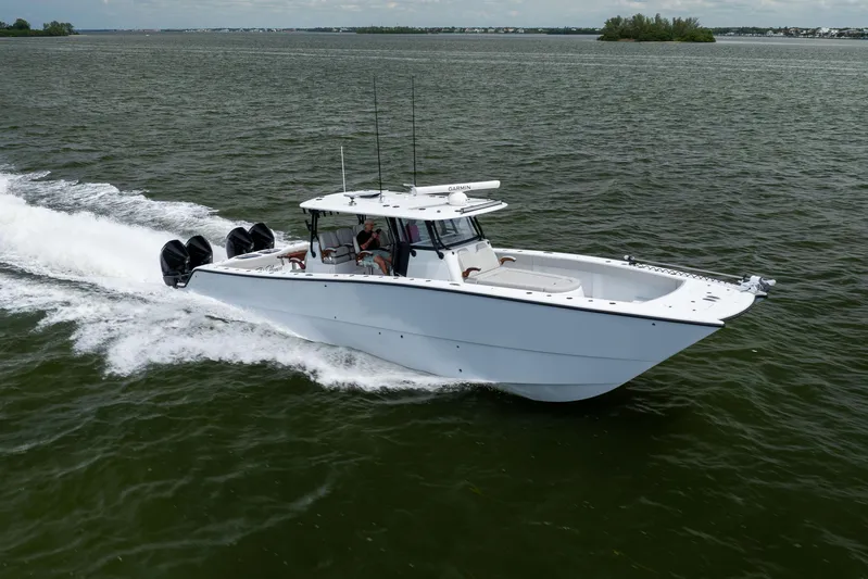  Yacht Photos Pics 2025 Freeman 42 LR boat cruising on open water with four engines.