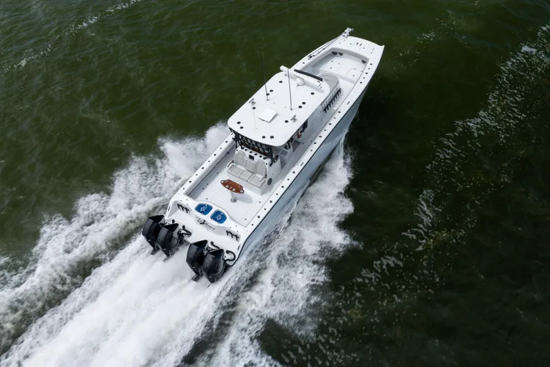  Yacht Photos Pics Aerial view of 2025 Freeman 42 LR boat cruising on water.