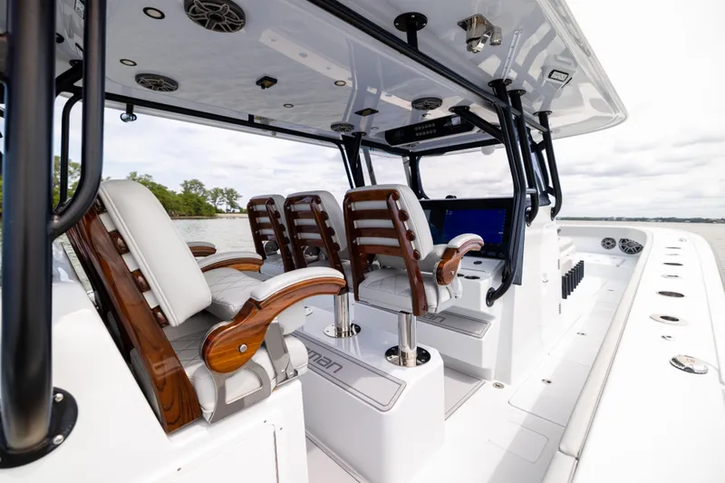 Yacht Photos Pics Luxury interior of 2025 Freeman 42 LR boat with elegant seating and advanced controls.