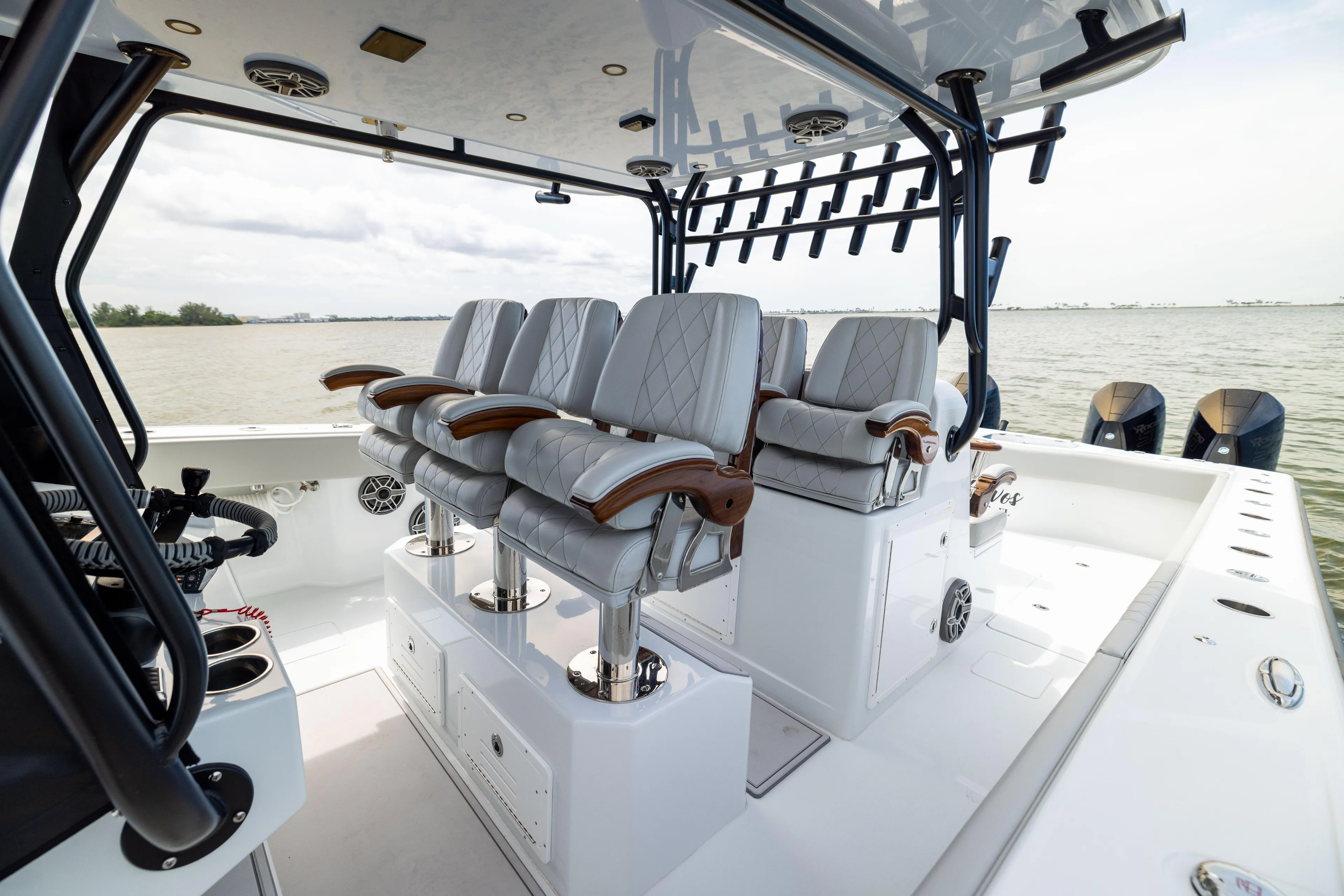 Yacht Photos Pics Luxury seating on 2025 Freeman 42 LR boat, featuring elegant design and ocean backdrop.
