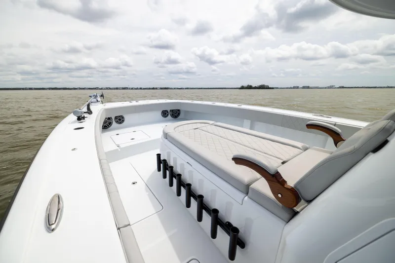  Yacht Photos Pics Luxury Freeman 42 LR boat interior, 2025 model, featuring elegant seating and rod holders on open water.