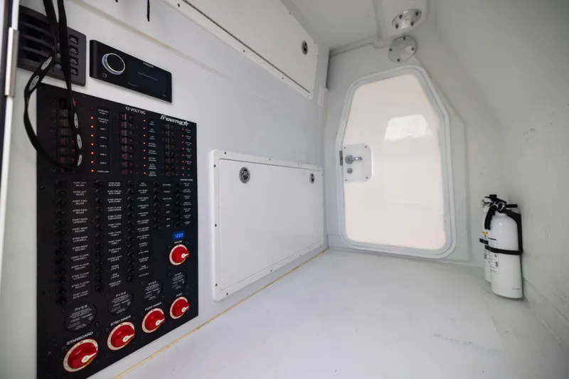  Yacht Photos Pics Interior of 2025 Freeman 42 LR boat with control panel and fire extinguisher.