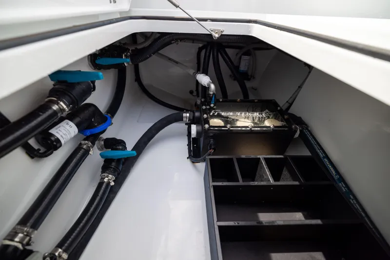  Yacht Photos Pics Engine compartment of 2025 Freeman 42 LR boat, showcasing pipes and mechanical components.