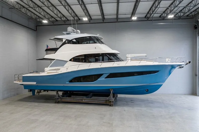  Yacht Photos Pics 2021 Riviera 64 Sports Motor Yacht in a spacious indoor setting.