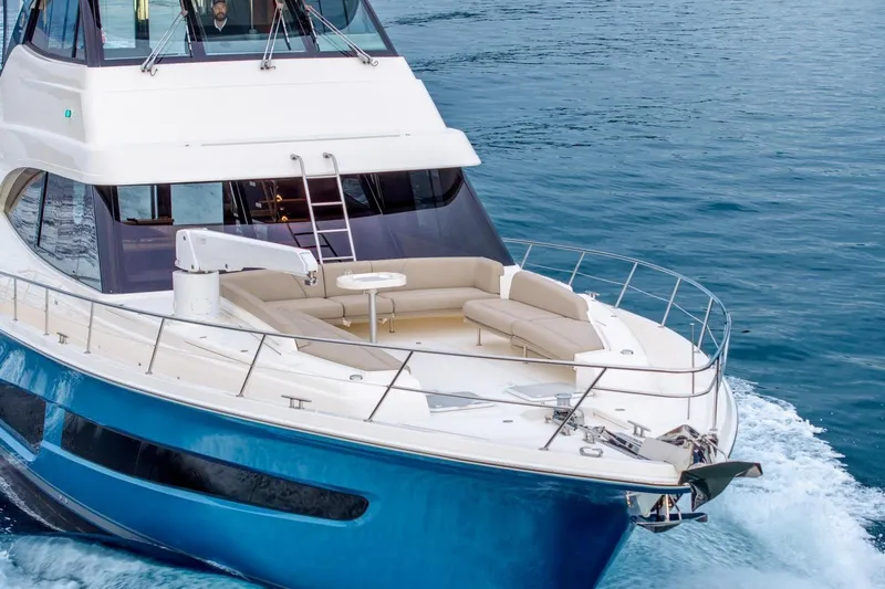  Yacht Photos Pics 2021 Riviera 64 Sports Motor Yacht cruising on open water.