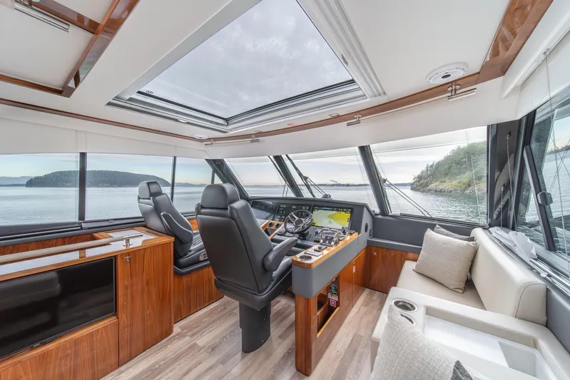  Yacht Photos Pics Luxurious interior of 2021 Riviera 64 Sports Motor Yacht with panoramic views.