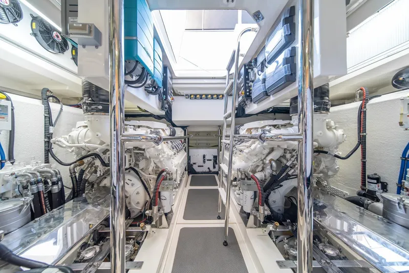  Yacht Photos Pics Engine room of 2021 Riviera 64 Sports Motor Yacht, showcasing dual engines and equipment.