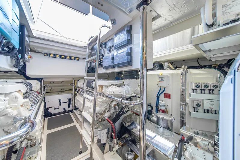  Yacht Photos Pics Engine room of 2021 Riviera 64 Sports Motor Yacht, showcasing advanced machinery and controls.