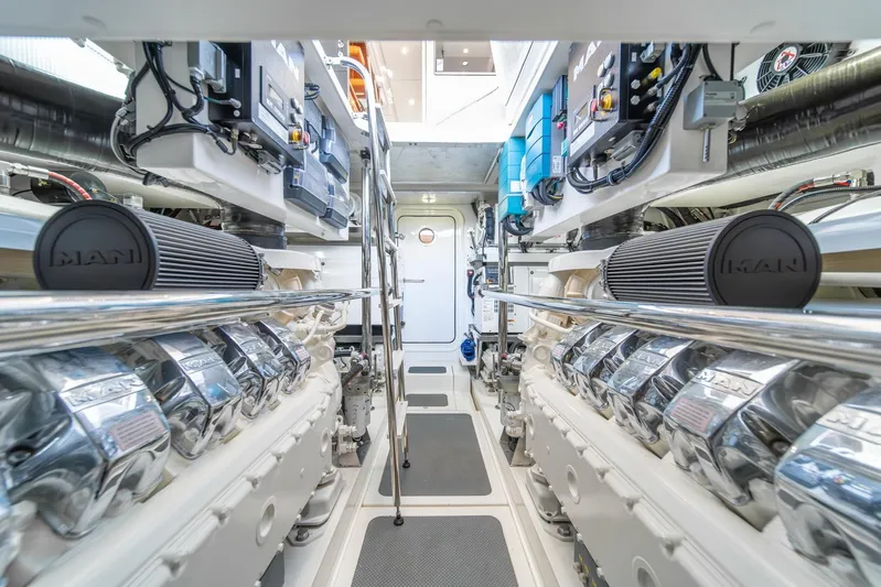  Yacht Photos Pics Engine room of 2021 Riviera 64 Sports Motor Yacht, featuring dual MAN engines.