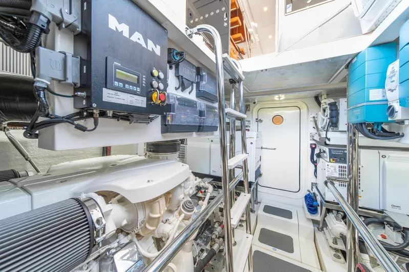  Yacht Photos Pics Engine room of 2021 Riviera 64 Sports Motor Yacht with advanced equipment and controls.