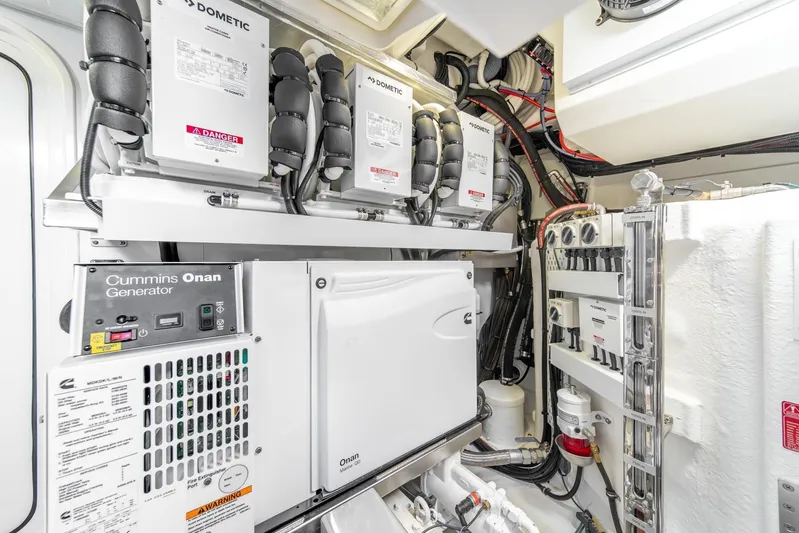  Yacht Photos Pics Engine room of 2021 Riviera 64 Sports Motor Yacht with Cummins Onan generator.