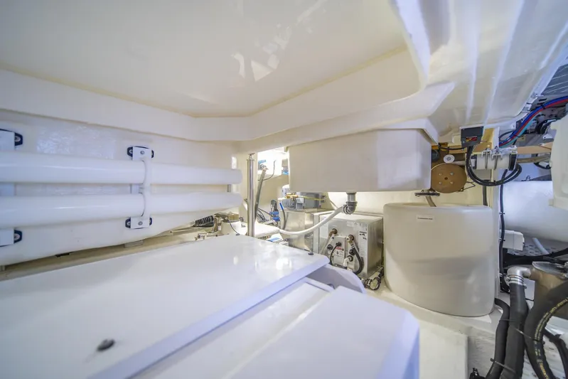  Yacht Photos Pics Engine room of 2021 Riviera 64 Sports Motor Yacht, showcasing mechanical components and systems.