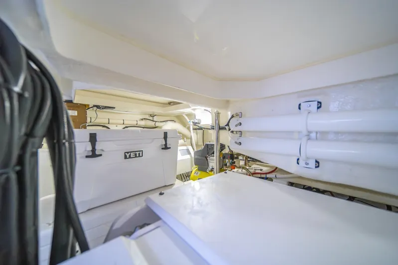  Yacht Photos Pics Engine room of 2021 Riviera 64 Sports Motor Yacht with Yeti cooler and equipment.