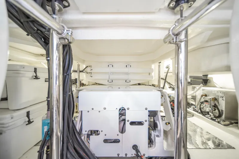  Yacht Photos Pics Engine room of 2021 Riviera 64 Sports Motor Yacht with equipment and wiring.