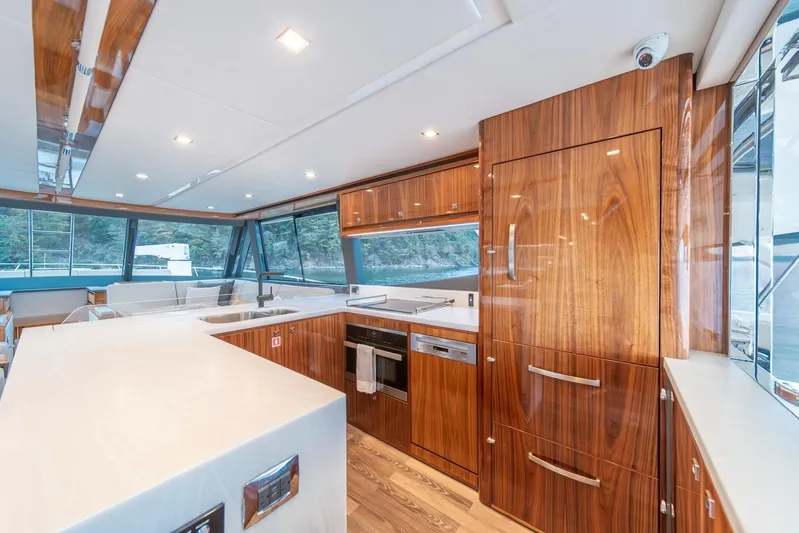  Yacht Photos Pics Luxurious interior of 2021 Riviera 64 Sports Motor Yacht with modern kitchen design.