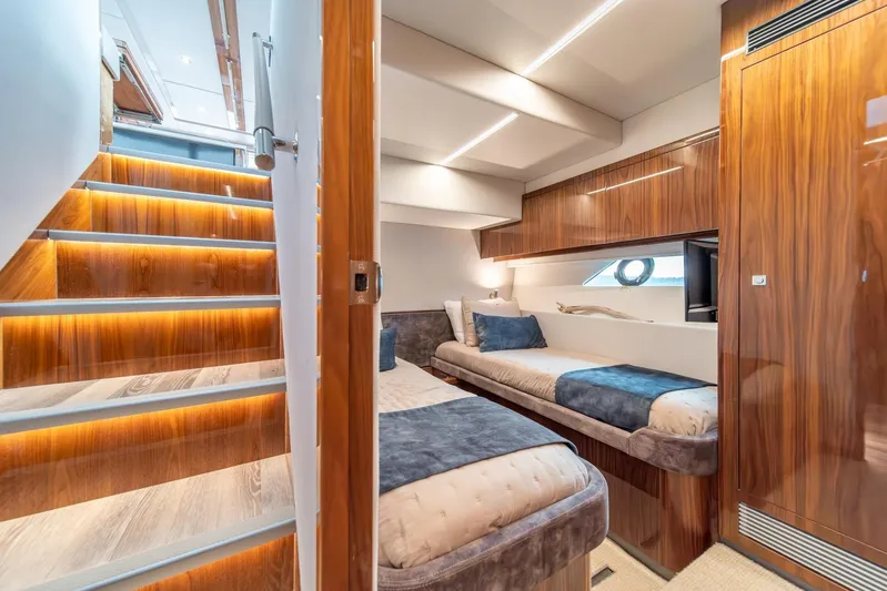  Yacht Photos Pics Luxurious interior of 2021 Riviera 64 Sports Motor Yacht with elegant wood finishes.