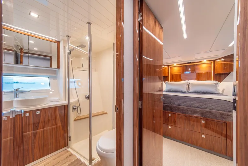  Yacht Photos Pics Luxurious interior of 2021 Riviera 64 Sports Motor Yacht with bedroom and bathroom.