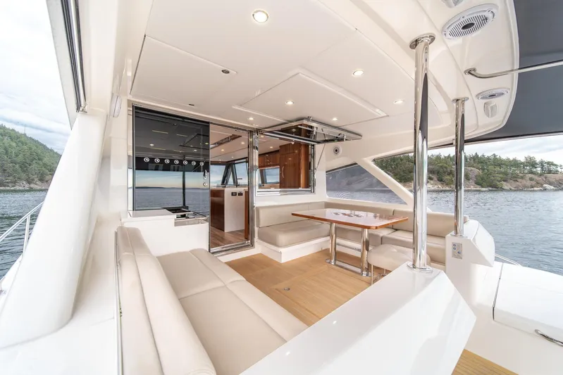  Yacht Photos Pics Luxurious interior of 2021 Riviera 64 Sports Motor Yacht with scenic ocean view.
