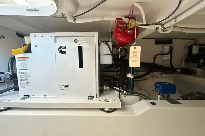  Yacht Photos Pics Engine room of 2023 Tiara Yachts 38 LS with Cummins Onan Marine QD generator.