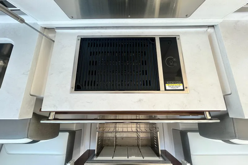  Yacht Photos Pics 2023 Tiara Yachts 38 LS kitchen with Kenyon grill and modern design.