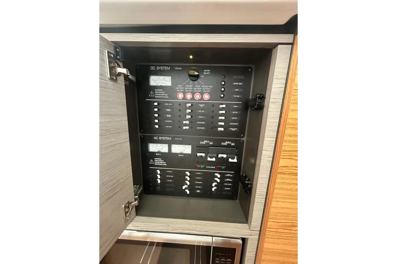  Yacht Photos Pics Electrical panel inside 2023 Tiara Yachts 38 LS, featuring DC and AC systems.