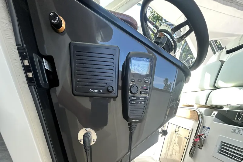  Yacht Photos Pics 2023 Tiara Yachts 38 LS helm with Garmin controls and steering wheel.